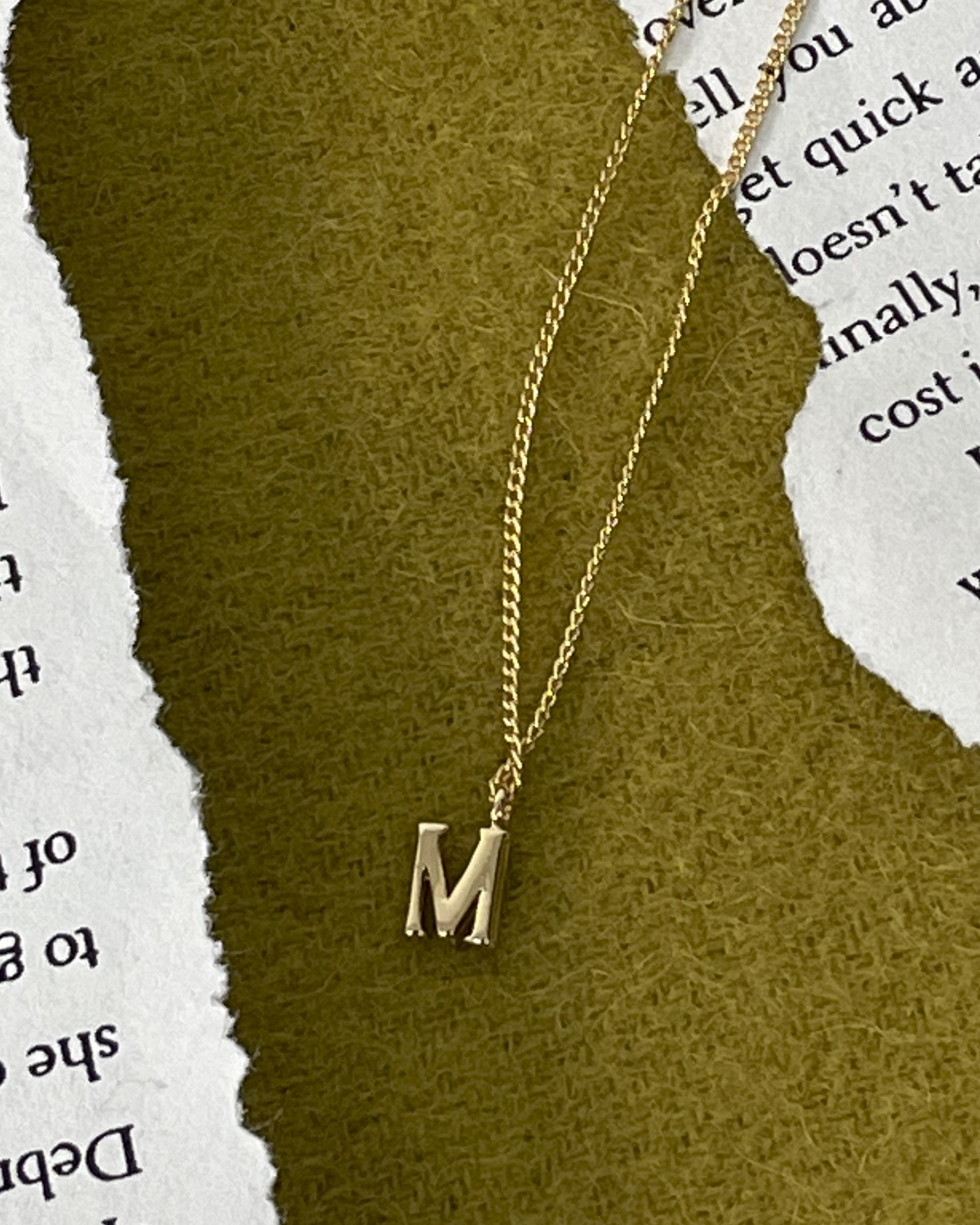 M gold necklace